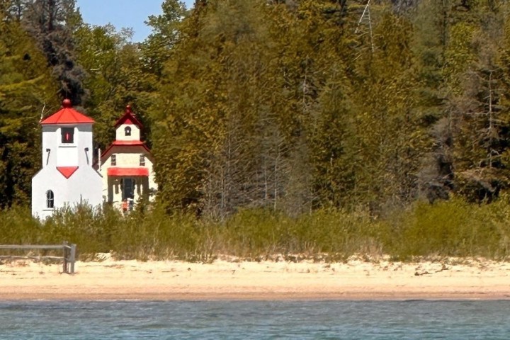 a boat traveling down a dirt road