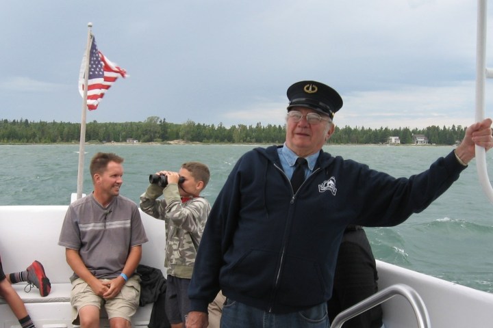 a group of people in a boat on a body of water