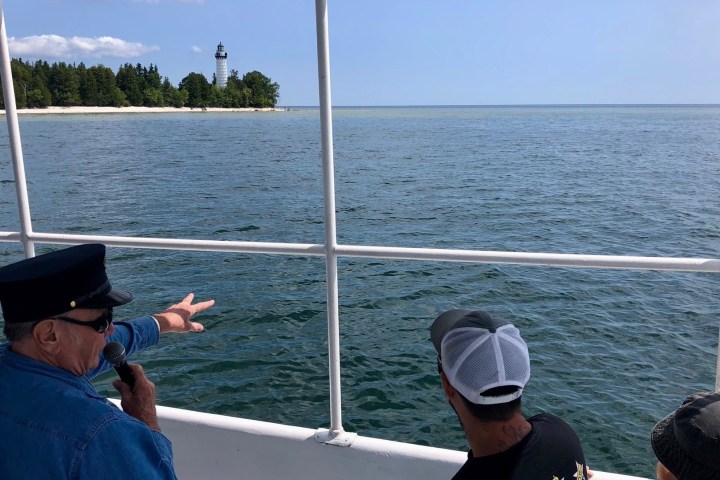 a group of people in a boat on a body of water