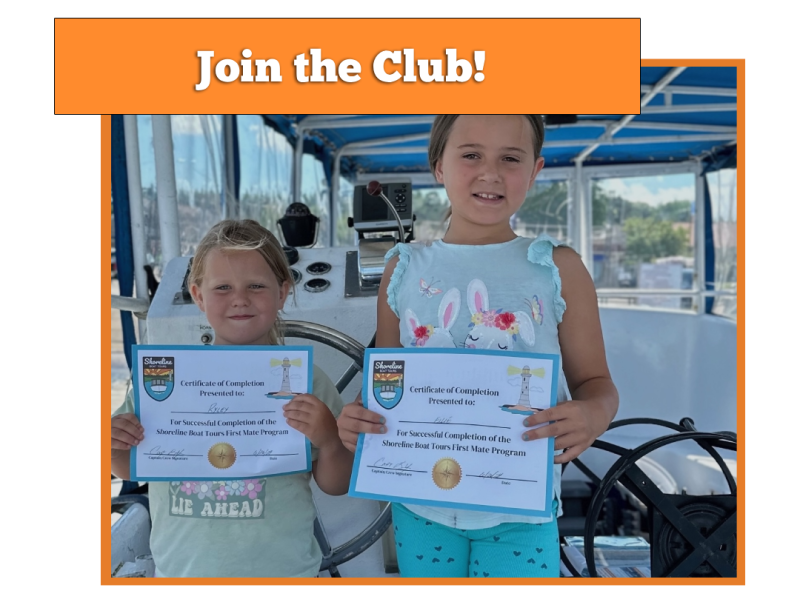 a person holding a sign posing for the camera