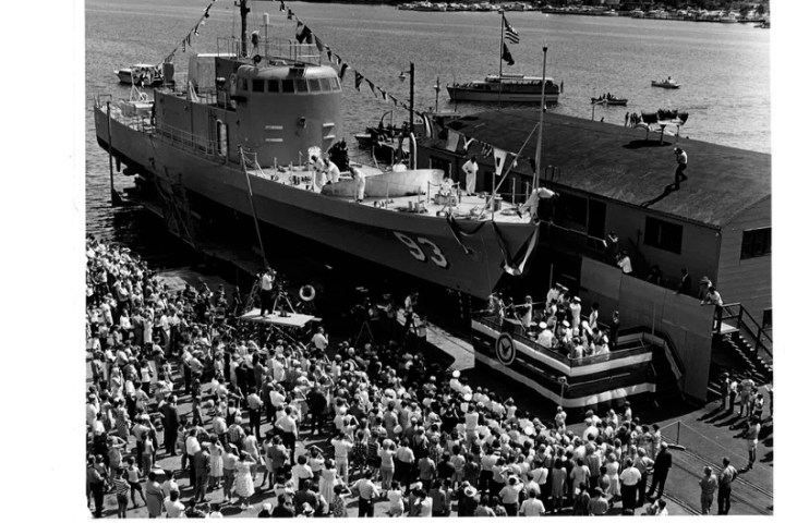 a group of people on a boat in a large body of water