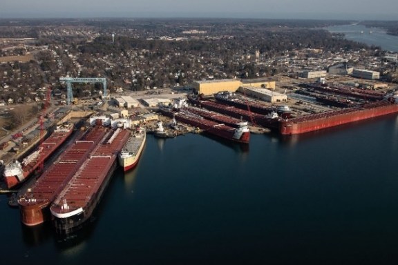 a large body of water with a city in the background