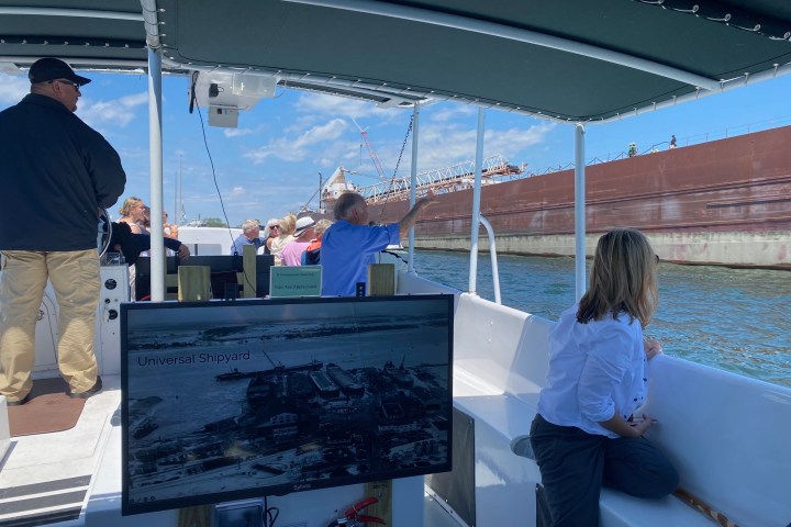 a man standing in front of a boat