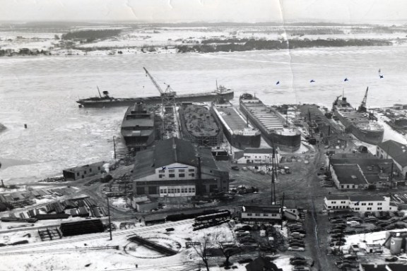 a boat is docked next to a body of water