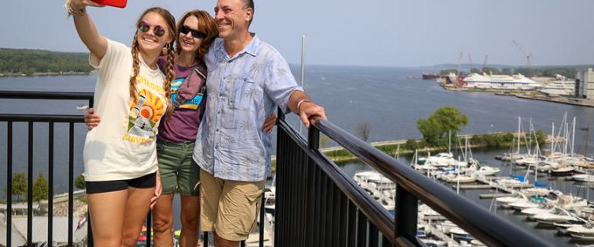 a person standing next to a body of water