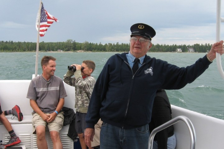 a group of people in a boat on a body of water