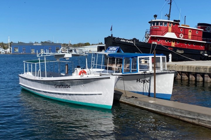 a boat is docked next to a body of water