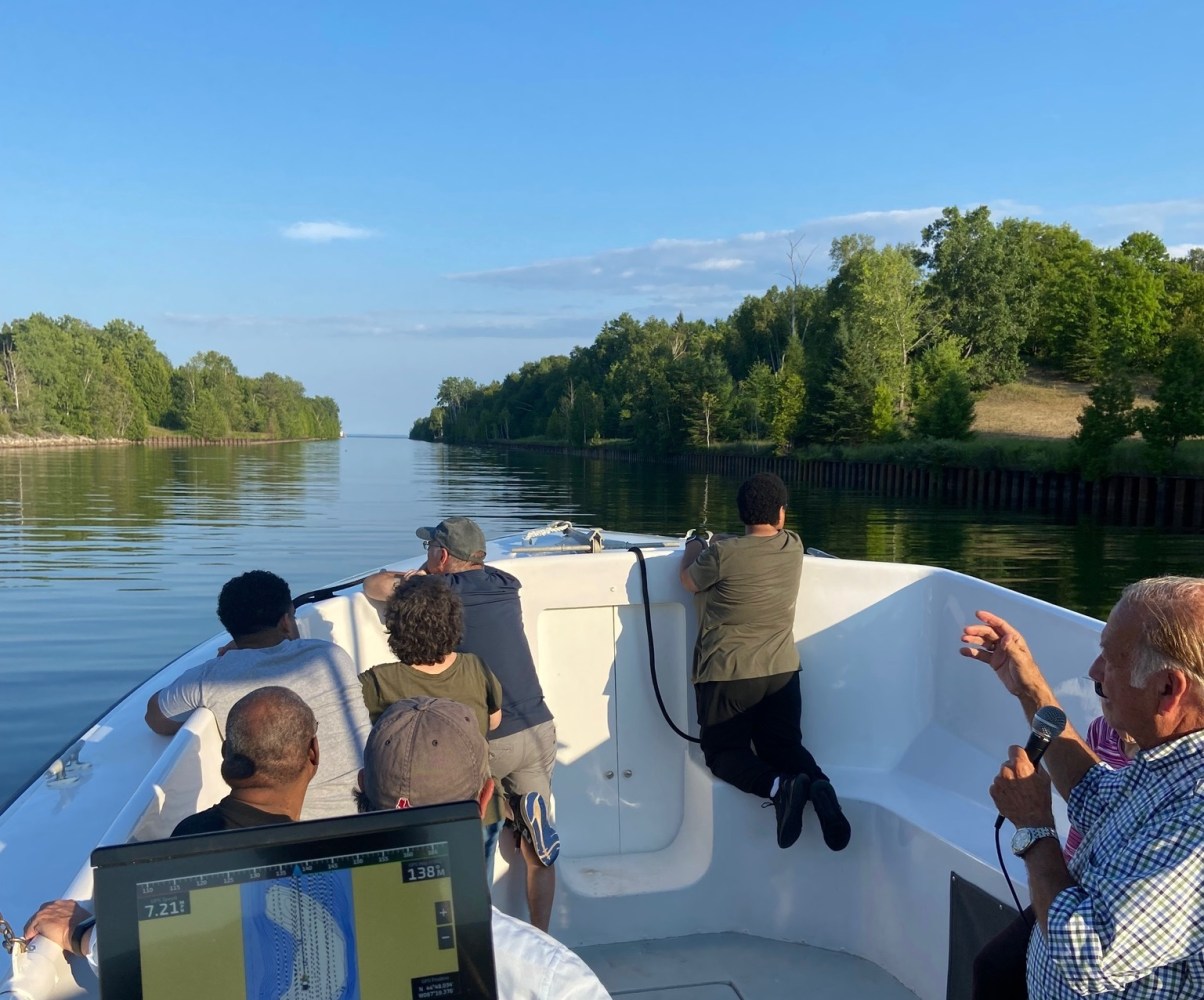a group of people on a tour boat in the sturgeon bay ship canal