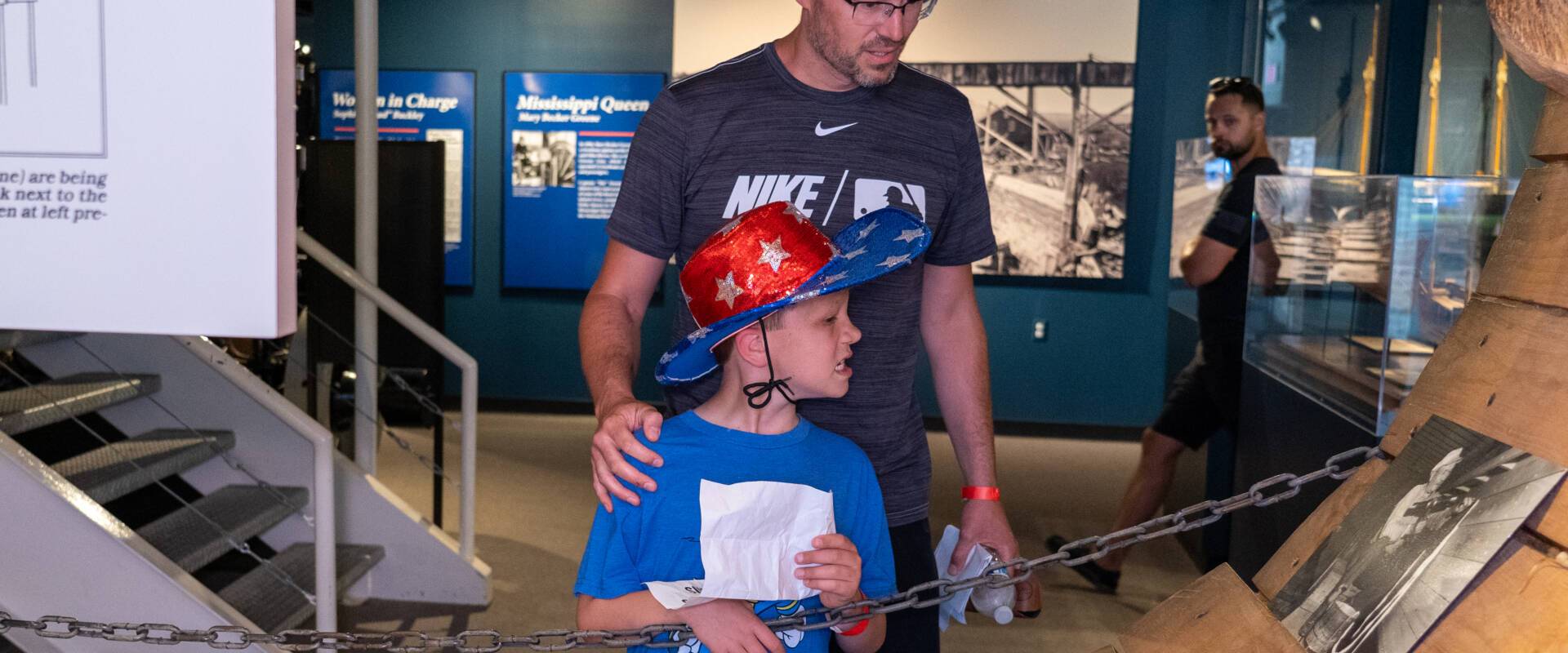 a father and son inside a Wisconsin Maritime Museum exhibit gallery