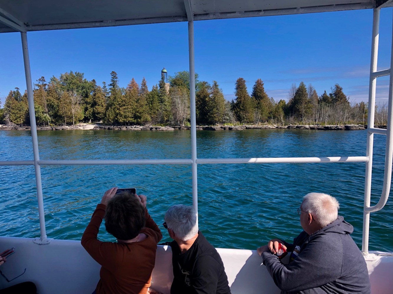 a group of people in a boat on a body of water