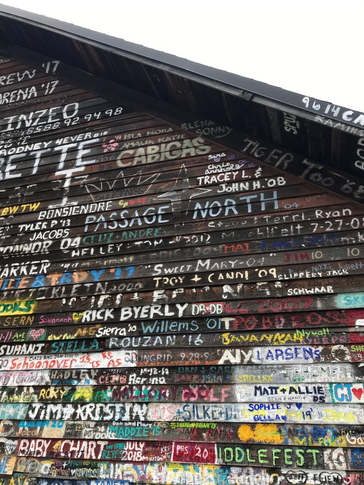 colorful graffiti on the side of an old building