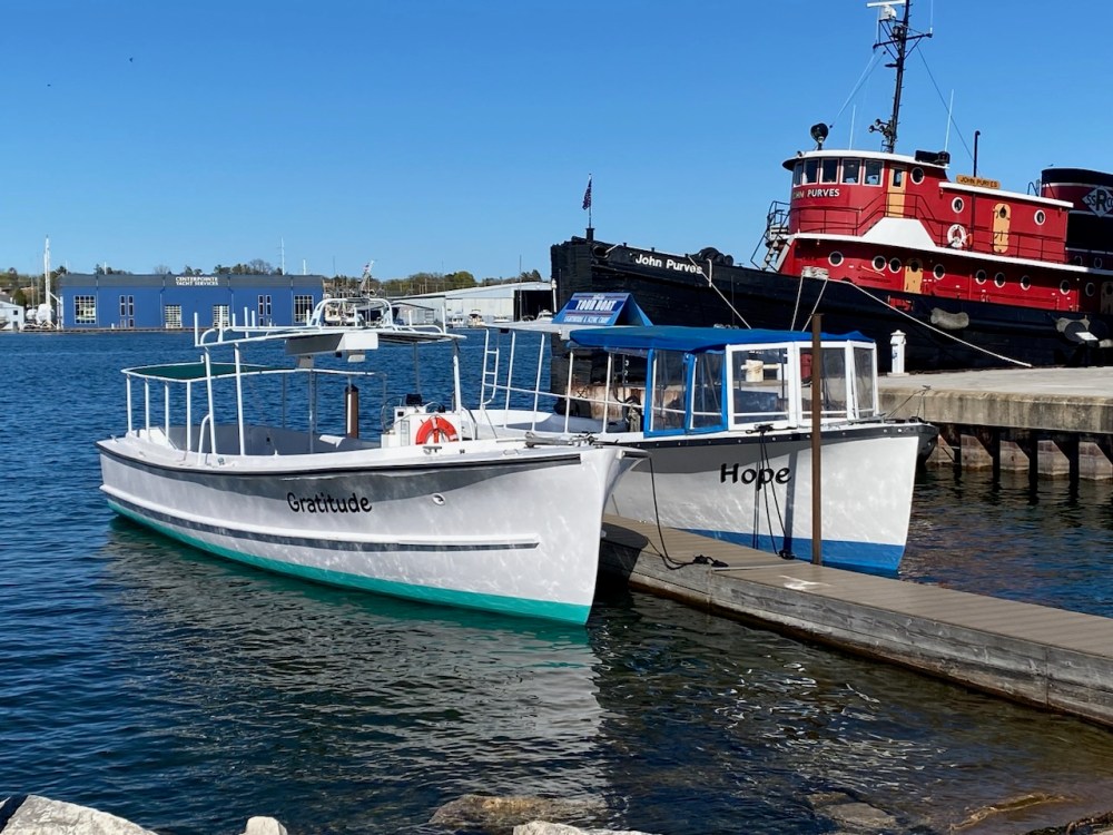 a boat is docked next to a body of water